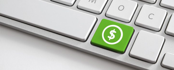 Keyboard with green dollar sign key.